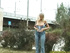 Blonde vixen pulls down her jeans to take a pee near a highway