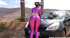 Green-haired teen in purple suit and high heels playing with huge red dildo for asshole at the car