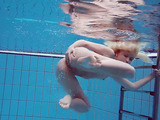 Petite blonde teenager underwater