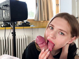Teen blonde wears red lipstick while giving blowjob