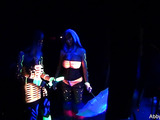 Mouthwatering babes in some behind the scenes shots on a black light shoot.